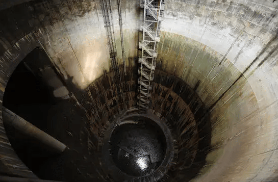 The flow of sewage in a sewer