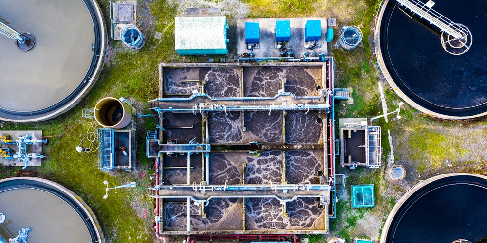 Aerial view of waste water treatment plant with tanks